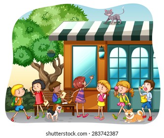 Children eating and walking in front of a shop