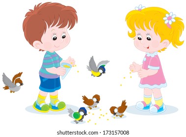 Children feed small birds