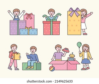 The children are happy to receive the gift. They are opening the box. Characters with cute faces with outlines. flat design style vector illustration.