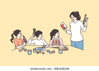 Children hobbies and drawing concept. Young mother or teacher standing and explaining sitting group of kids how to paint vector illustration 