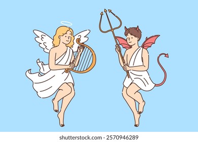 Children in images of angel and demon demonstrate festive costumes for halloween or religious holiday. Cute girl dressed as angel holds harp located near boy with demon trident in hands