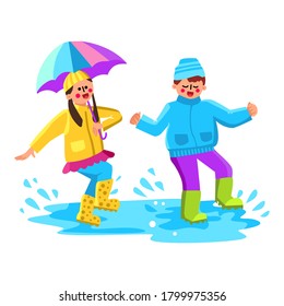 Children Jumping In Puddle With Splash Vector. Happy Boy And Girl Kids Wearing Rubber Boots And Rain Clothes Jump In Puddle. Characters Playing And Splashing Water Flat Cartoon Illustration