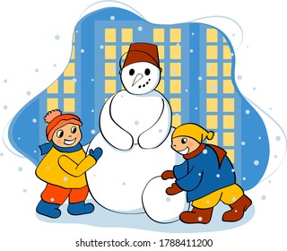 Los niños hacen un muñeco de nieve en invierno