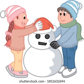Children making a snowman at Christmas