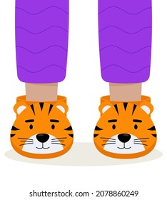 Children pajama slippers. Children feet in funny slippers. Pajama party.