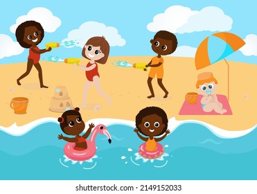 Children Play On The Beach,girls And Boy Had A Water Battle And Sit Under A Sun Umbrella. The Boy Inflates An Inflatable Ring, The Baby Sits On A Blanket, The Children Swim In The Sea. 