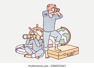 Children play sailors with vintage nautical things and dream of becoming travelers. Little boy and girl use spyglasses looking in different directions and pretending to be sailors on ship