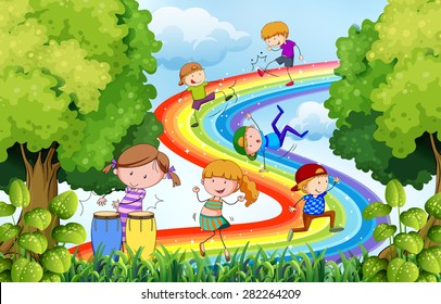 Children playing over the colorful rainbow