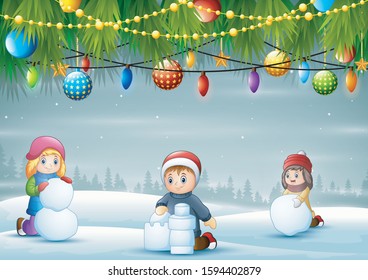 Children playing snow in the snowy park