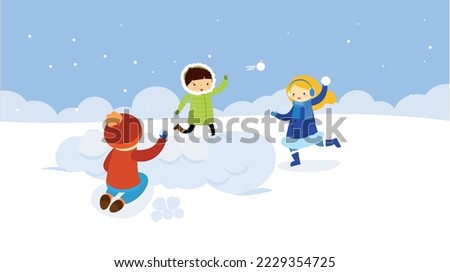 Children playing snowballs in winter