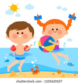 Children playing and swimming in the sea.