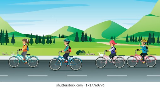 Children riding bicycles to school with a mountain in the background.