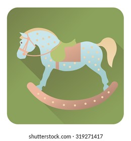Children rocking horse on a green