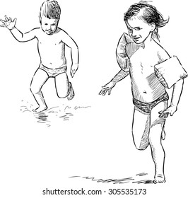 children running along the seashore