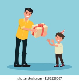 Children s birthday. The father gives his son a gift for his birthday.