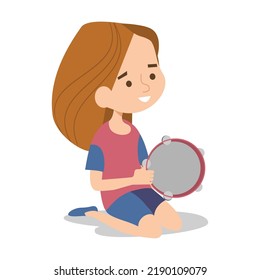 Children sitting on grass and playing musical tambourine instrument. Kids enjoying outdoor music class. Daycare activities