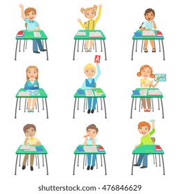 Children Sitting At School Desks In Class