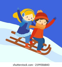 children sledding down the hill