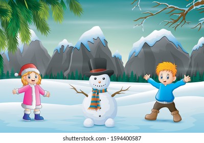 Children with snowman in snowy landscape