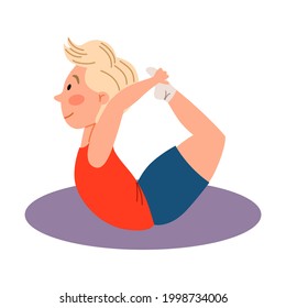 Children sports gymnastics. The boy is lying on his stomach, his hands clinging to his legs. Exercises for the back.