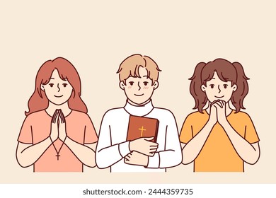 Children sunday school students make prayer gestures and hold holy bible or christian crosses in hands. Christian children from catholic or orthodox fold learn to perform religious rituals