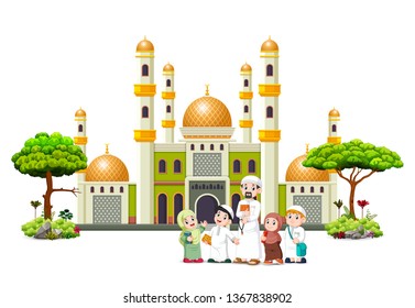  the children with their father are posing in front of the green mosque