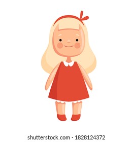 Children toy doll in a red dress with blond hair