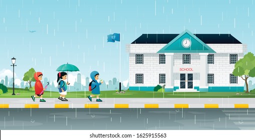Children walking to school while it rains. 