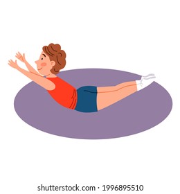 Childrenes sports gymnastics. The boy is lying in the boat pose. Exercises for the back.