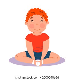 Childrenes sports gymnastics. The boy is sitting in the lotus position. Exercises for stretching the leg muscles.