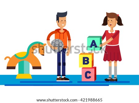 Children's activity in the kinder garden, playing, education. Kids playing at playground. Childhoods. Girl puts words from letters cubes. Boy holding a soccer ball