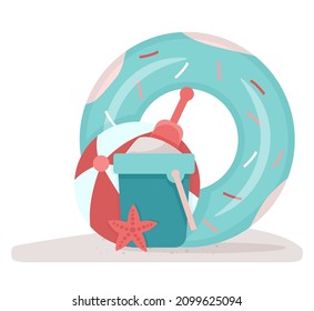 Children's beach holidays. A bucket of sand and ball on the beach. 