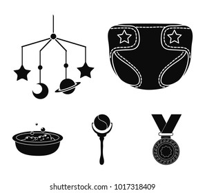 Children's diapers, a toy over the crib, a rattle, a children's bath. Baby born set collection icons in black style vector symbol stock illustration web.