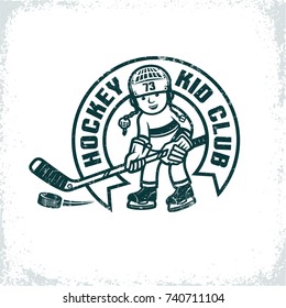 Children's retro emblem for the hockey club. Boy in uniform and helmet with stick and puck. Worn texture on  separate layer and can be easily disabled.