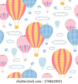 Children's seamless pattern with air balloons, clouds and birds on white background. Cute texture for kids room design, Wallpaper, textiles, wrapping paper, apparel. Vector illustration