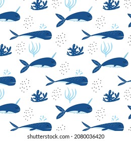 Childrens seamless pattern with blue whales. Patter with cute whale and narwhal. Suitable for fabrics, wrapping papers and prints.