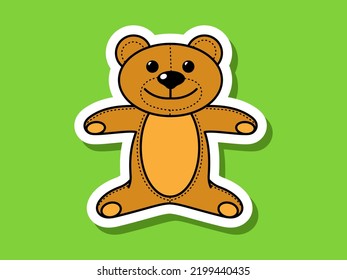 Children's sticker teddy bear on a green background.	