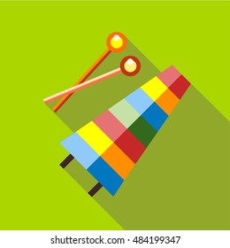 Children's toy musical xylophone on a red background