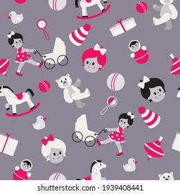 Children's toys, dolls, a stroller, a bear, balls are scattered on the grey background