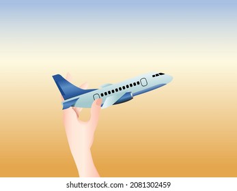 child's hand with an airplane dream of traveling in the summer in the sky