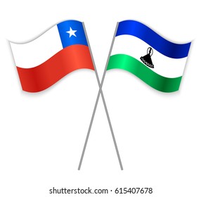 Chilean and Basotho crossed flags. Chile combined with Lesotho isolated on white. Language learning, international business or travel concept.