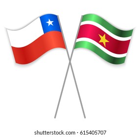 Chilean and Surinamese crossed flags. Chile combined with Suriname isolated on white. Language learning, international business or travel concept.