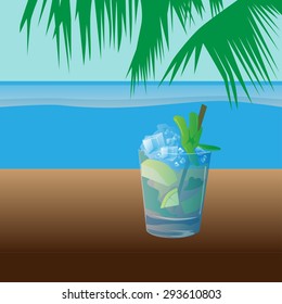 Chilled mojito on a table under a palm tree