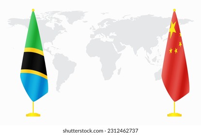 China and Tanzania flags for official meeting against background of world map.