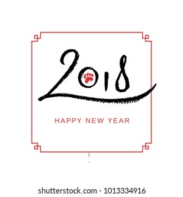 Chinese black stylized 2018 calligraphy lettering with red little dog paw on white rice paper background with red traditional frame. Lunar calendar, Year of the Dog.