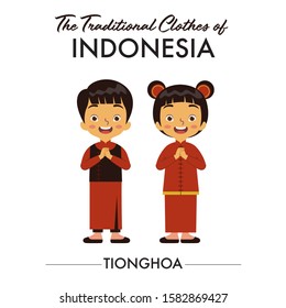 Chinese boy and girl, one of ethnic in Indonesia, are wearing cheongsam as their traditional clothes from China, they are also saying welcome