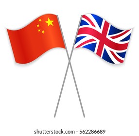 Chinese and British crossed flags. China combined with United Kingdom isolated on white. Language learning, international business or travel concept.