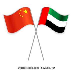 Chinese and Emirian crossed flags. China combined with United Arab Emirates isolated on white. Language learning, international business or travel concept.