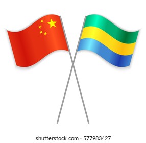 Chinese and Gabonese crossed flags. China combined with Gabon isolated on white. Language learning, international business or travel concept.