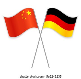 Chinese and German crossed flags. China combined with Germany isolated on white. Language learning, international business or travel concept.